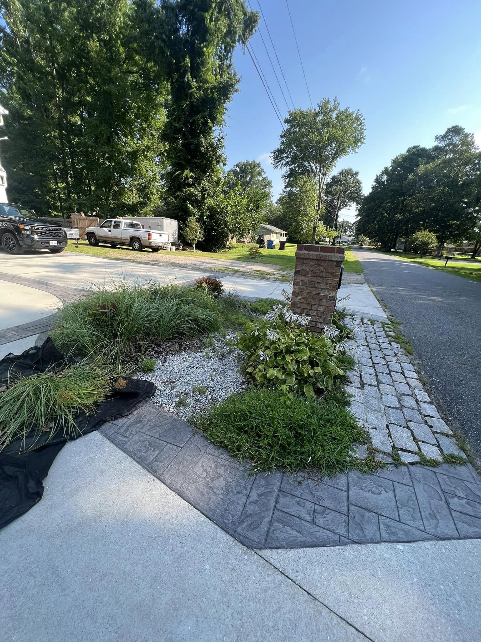 Front yard planting bed with stone edging