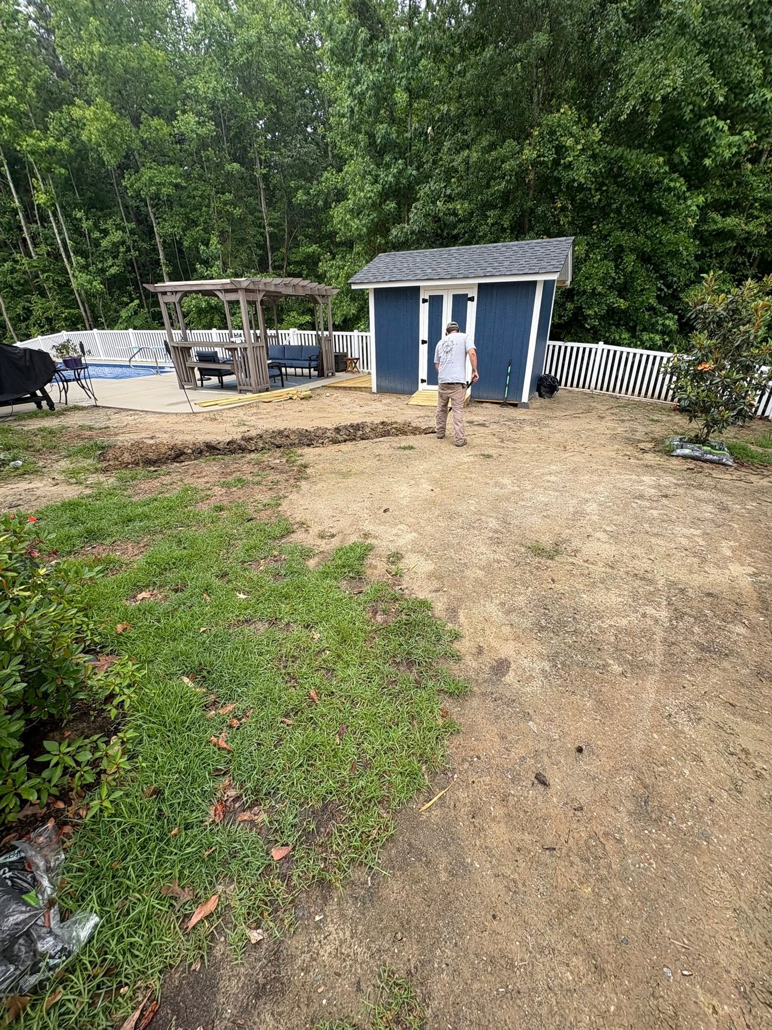 Backyard regraded around a shed