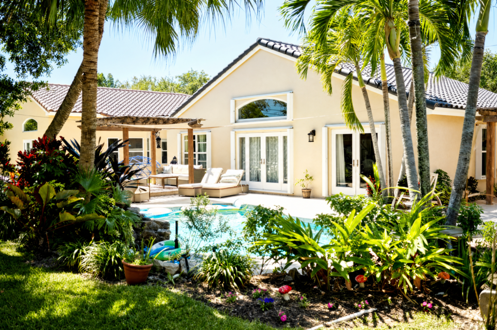Florida backyard with pool and tropical landscaping